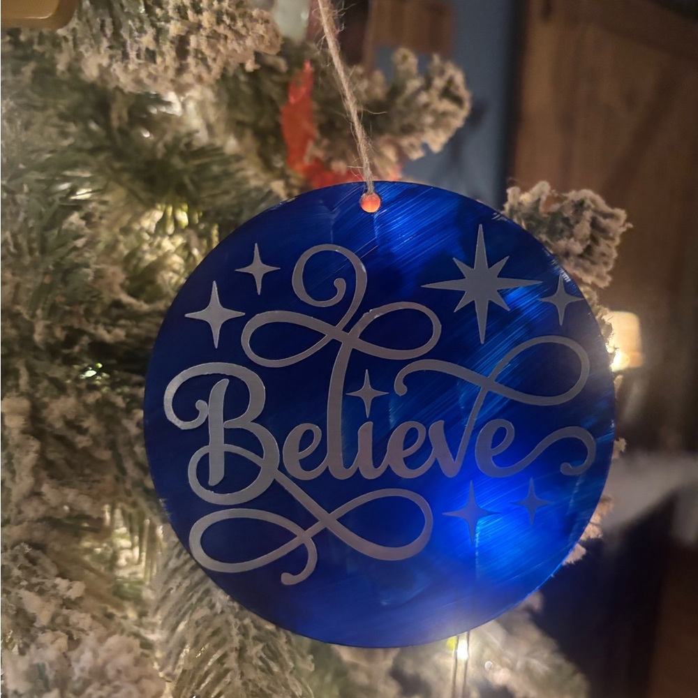 Blue Holiday Ornament with 'Believe' Design